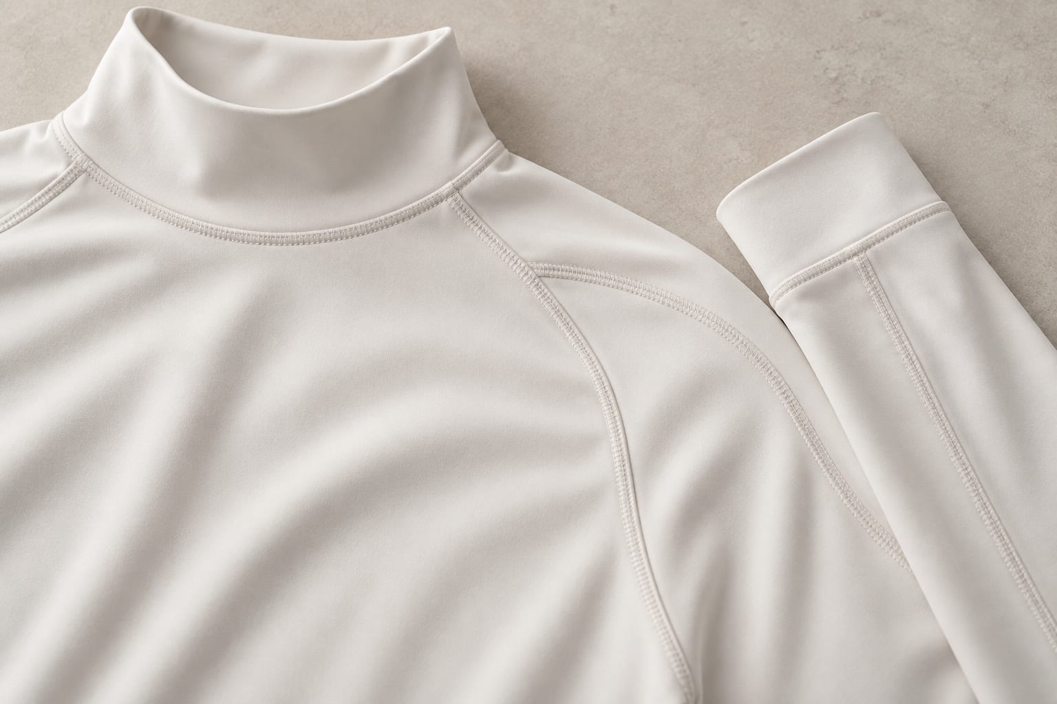 Sun-coverage long-sleeve base layer construction and material close-up concept