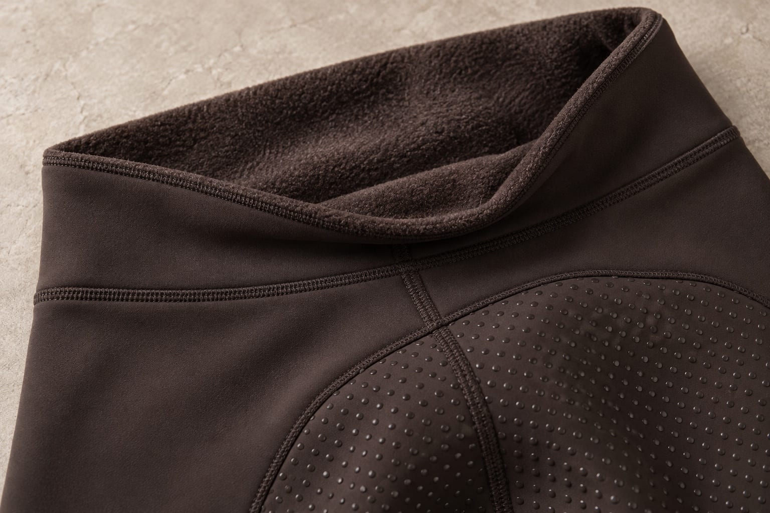 Winter riding tights detail showing a material application concept
